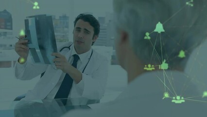 Poster - Animation of network of social media icons over caucasian male doctor with x ray and patient
