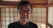 Smile, portrait and senior Japanese man at his home with positive, good and confident attitude. Happy, glasses and face of elderly male person in retirement with pride in modern house in Tokyo Japan.