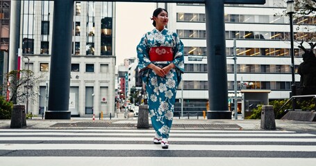 Woman, Japanese traditional clothes and walking in city, zebra crossing and travel with journey outdoor. Fashion, adventure and urban street in Kyoto, kimono or dress for culture and style with trip