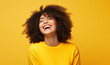 Happy girl with perfect laughing and smiling isolated on yellow background.