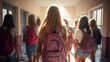 A cheerful teenage girl stands in a high school hallway, smiling at the camera while her friends linger in the background