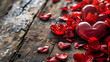 A symbol of love and passion, a red heart candy rests upon a bed of carmine petals, basking in the warm glow of a romantic valentine's day outdoor picnic on a wooden surface