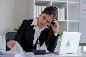 Business woman feeling tired from working in the office