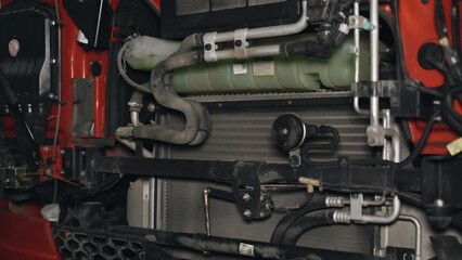 Poster - Truck engine compartment. View of the cooling system, pipes and other equipment.