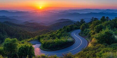 Wall Mural - Winding Road Through a Sunset Kissed Forested Mountain