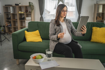 Wall Mural - Expectant woman read leaflet take tablets medication or supplement