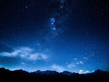 A Starry Sky Over Mountains
