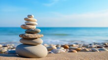 Vacation Relax Summer Holiday Travel Tropical Ocean Sea Panorama Landscape - Close Up Of Stack Of Round Pebbles Stones On The Sandy Sand Beach, With Ocean In The Background