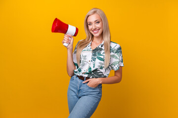 Canvas Print - Photo of good mood adorable girl with long hairdo dressed print shirt hold loudspeaker arm in pocket isolated on yellow color background