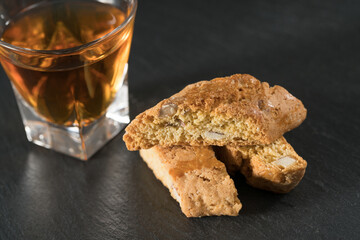 Detail of Cantuccio almond biscuits with Vino Santo, a typical dessert of Florence and of the Tuscan tradition in Italy