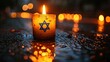 Burning candle in the shape of the flag of Israel on a rainy day. Selective focus.