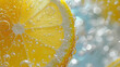 Lemon slice drop in fizzy sparkling water, juice refreshment