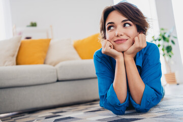 Wall Mural - Photo of dreamy adorable cute girl lying on carpet in cozy living room enjoying harmony indoors