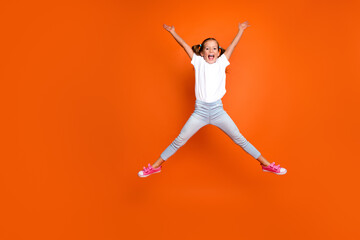 Sticker - Full size portrait of active overjoyed girl jump make star figure empty space isolated on orange color background