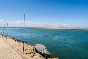 Sticker - Fishing from the pier on Atlantic Ocean in Isla Canela in Andalusia, Spain