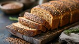Fototapeta  - Multi grain sourdough bread with flax seeds cut on a wooden board, closeup view. Healthy vegan bread choice