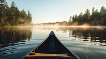 Bow Of A Canoe In The Morning On A Misty Lake In Ontario, Canada.