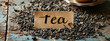 tea on a wooden table as a background and the inscription tea. drink
