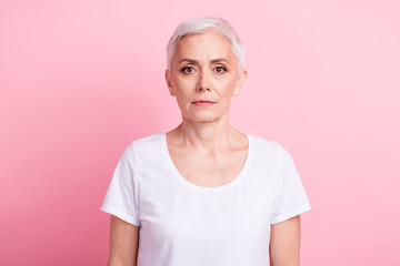 Poster - Photo portrait of attractive pensioner woman look camera dressed stylish white clothes isolated on pink color background