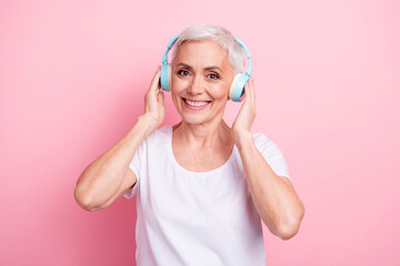 Sticker - Photo portrait of pretty retired female touch headphones listen music wear trendy white outfit isolated on pink color background