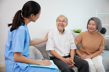 Wall Mural - nurse or caregiver meeting and talking with about health with senior couple