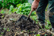 Using A Shovel To Agitate Compost Pile