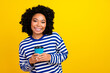 © deagreez - Photo of cheerful glad girl wear stylish sailor clothes hold hot fresh tasty tea latte empty space isolated on yellow color background