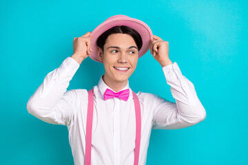 Sticker - Photo of attractive young man look empty space touch headwear dressed stylish pink clothes isolated on aquamarine color background