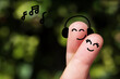 Happy finger, couple in love, Smile emoticon, Face emoticon on blurred park background.
