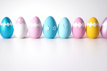 A Row Of Pastel Easter Eggs On White Background