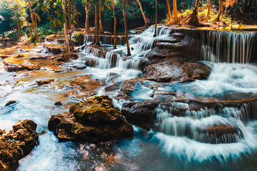  Beautiful of Huai mae khamin waterfall Srinakarin national park at Kanchanaburi thailand. Waterfall clear emerald water on autumn and summer season with rock for holiday relax on green tree in jungle.