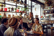 © Davor - Waitress taking order from customers at restaurant