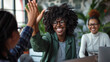 © Studio Nova - Joyful woman with glasses, smiling widely and giving a high-five, indicating a positive interaction or celebration