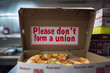 a photo of an anti union message left in a pizza box by an overbearing boss 