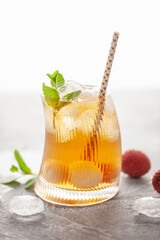 Wall Mural - Lychee iced tea with mint leaves in drinking glass. Refreshment drink