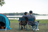 Fototapeta Uliczki - Happy Asian male gay couple on camping together in a forest. romantic vocation trip. lgbt concept
