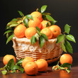fresh oranges in the wooden basket
