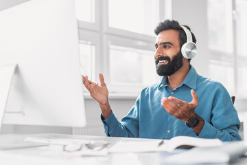 Aufkleber - Happy indian man with headphones in virtual meeting at work