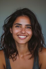 Aufkleber - A woman with long brown hair smiling at the camera. Suitable for various uses
