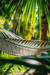 Poster - A relaxing scene of a hammock hanging between two palm trees. Perfect for travel and vacation themes