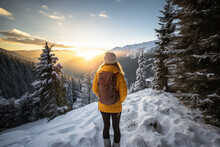 Generative AI Back View Image Of An Unrecognizable Woman In A Yellow Jacket Standing And Observing A Sunset In A Snowy Mountain Landscape