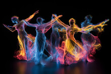 Silhouettes Of Group Dancing People In Colored Smoke Or Shine On Black Background. Abstract Luminescent Dance