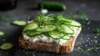 The fried bread is topped with a thin layer of creamy ricotta, thinly sliced fresh cucumber, and sprinkled with herbs. Beautiful background. Rustic.