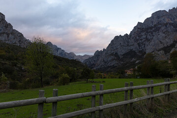 Wall Mural - Sunrise landscape over Picos de Europa national park in northern Cantabrian mountains of Spain during bright and sunny autumn day
