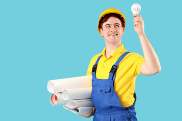 Poster - Male electrician with light bulb and house plans on blue background