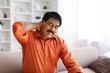© Prostock-studio - Suffering middle aged indian man feeling neck pain