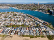 Aerial landscape view of Newport Beach, California homes, buildings and waterways
