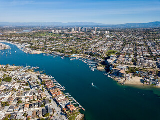 Aerial landscape view of Newport Beach, California homes, buildings and waterways