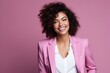 Beautiful african american woman in pink suit on pink background