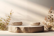 Elegant stone podiums staged with delicate dried flora against a soft-lit neutral backdrop
